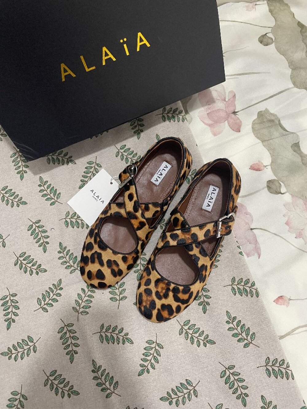 Alaïa Criss Cross Leopard Print Cross-Strap Ballet Flats